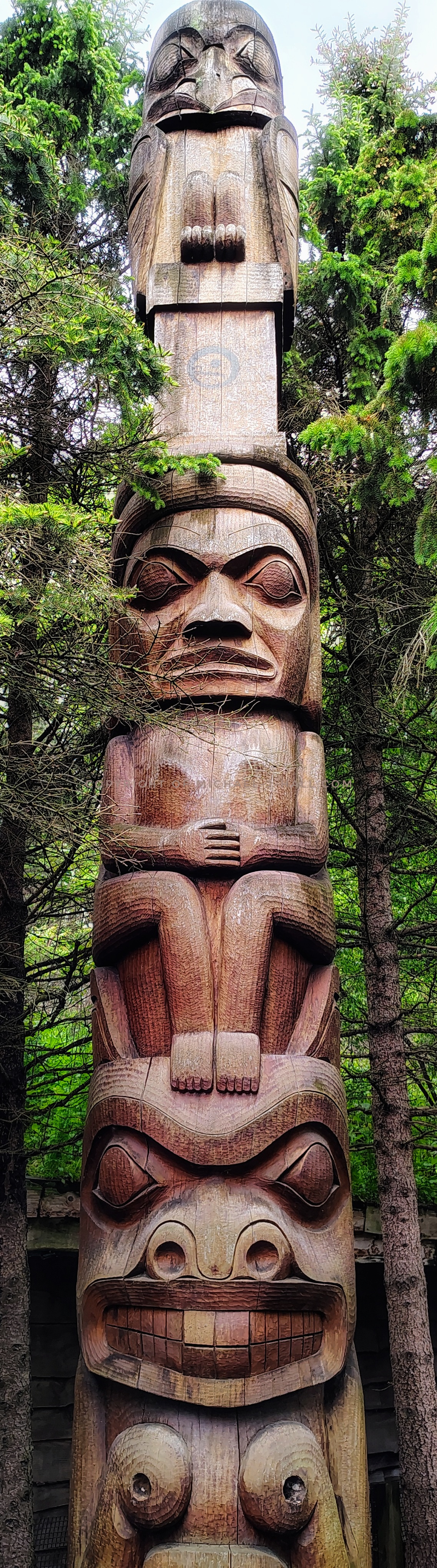 The 26 foot tall red cedar totem pole was hand carved by 2 Gitksan Nation Natives from British Columbia Canada. It was made using traditional methods with chisels, gouges, and handmade knives and symbolizes the cultural heritage of Indigenous peoples.