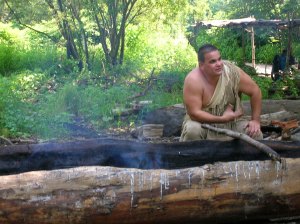 A mishoon is a traditional dug-out canoe made by the hollowing out the inside of a solid tree with the use of fire and scraping with shells.